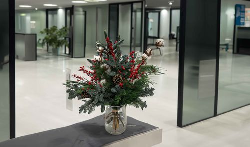 Bring the Holiday Spirit to Your Workspace: Jazz Up Your Office with Gorgeous Christmas Vase Flower Designs